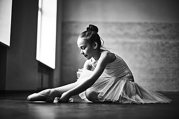 young girl stretching in her Ballet outfit funded by HAVlife